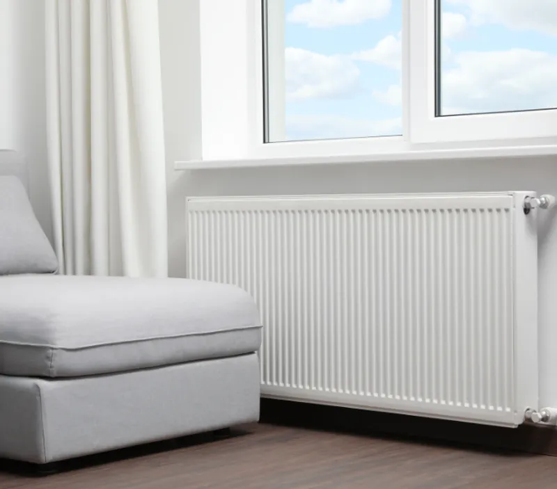 Heating engineer performing diagnostic checks